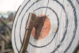 axe stuck in wooden target